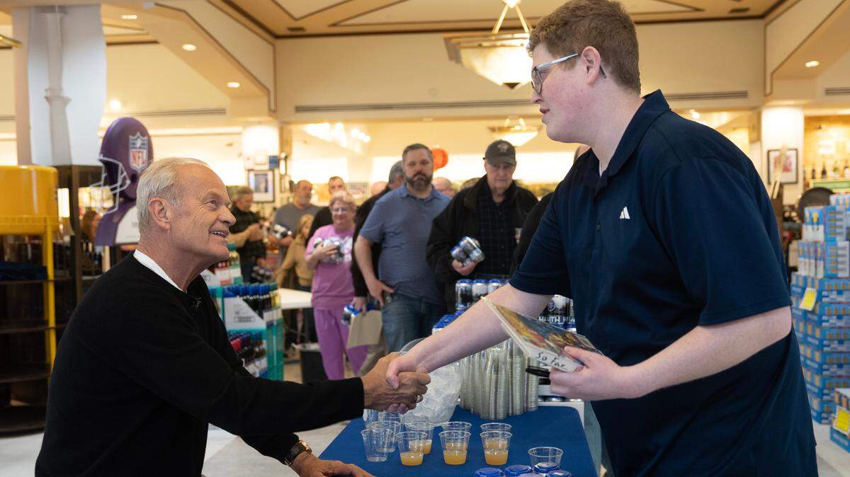 Actor Kelsey Grammer shakes hands with fan Christian Morrell during a public appearance at Jacob Liquor Exchange. Morrell was the first in line to meet Grammer, having arrived two hours early.