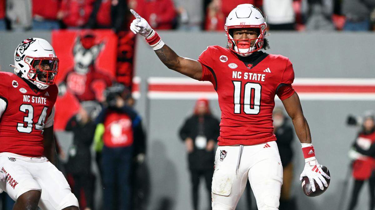 North Carolina State Wolfpack receiver KC Concepcion (10) reacts after scoring a touchdown against the North Carolina Tar Heels during the first half at Carter-Finley Stadium.