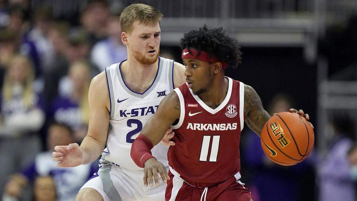 Kansas State’s Luke Kasubke pressures Arkansas’ Chris Lykes (11) during the first half of an NCAA college basketball game Monday, Nov. 22, 2021, in Kansas City, Mo. (AP Photo/Charlie Riedel)