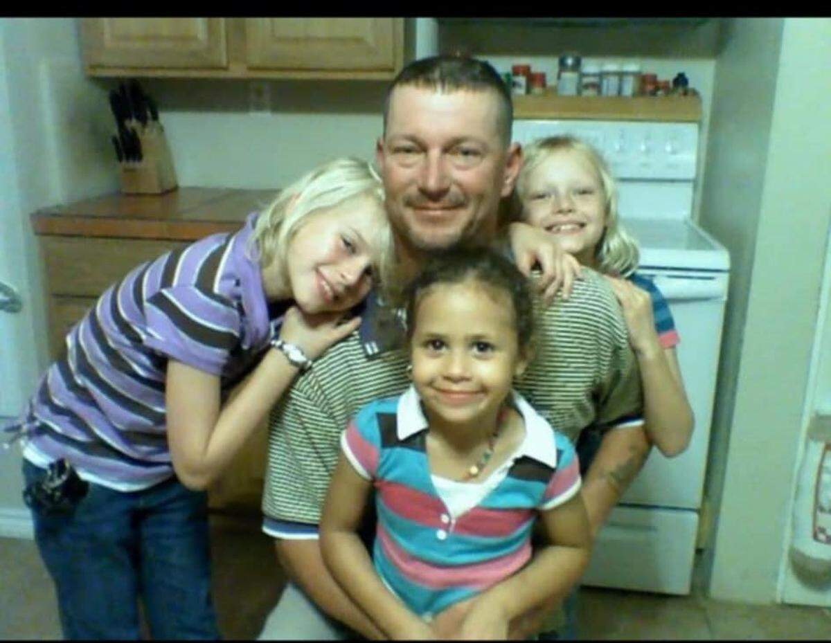 Naomi Oglesby with her sisters and their father.