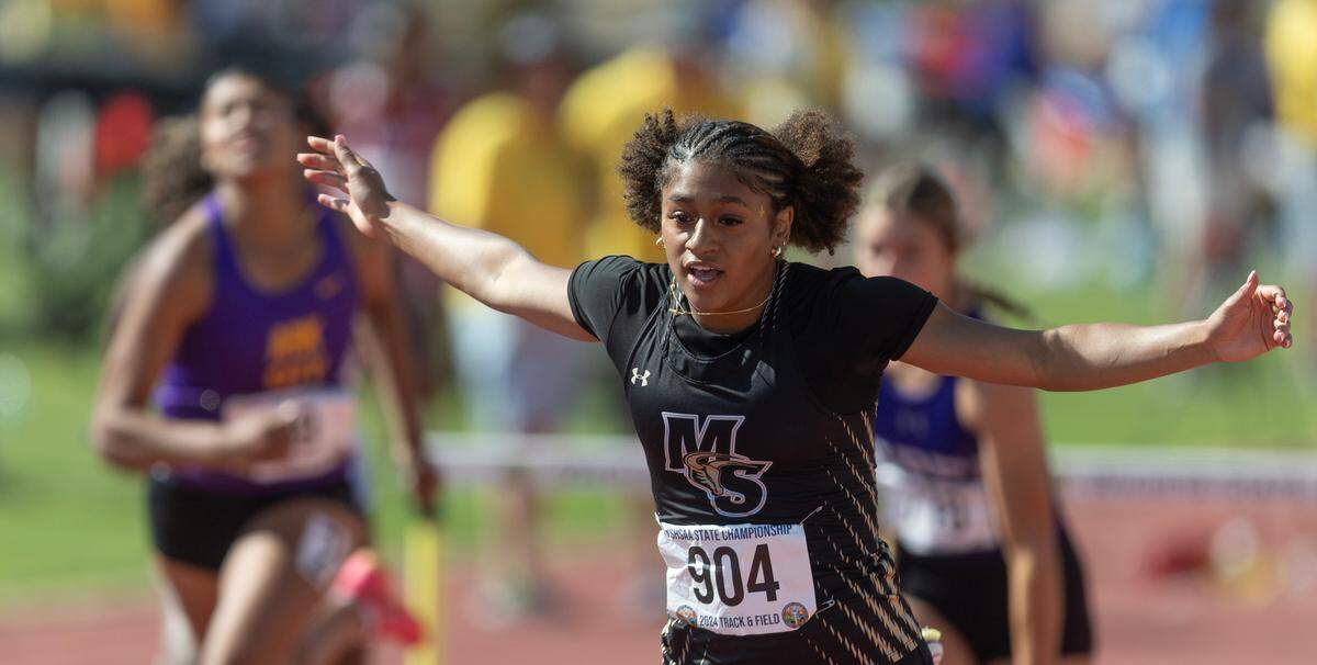 Maize South’s Ashley Singhateh wins the 5A 100 meter hurdles during the state track and field championships at Cessna Stadium on Saturday.