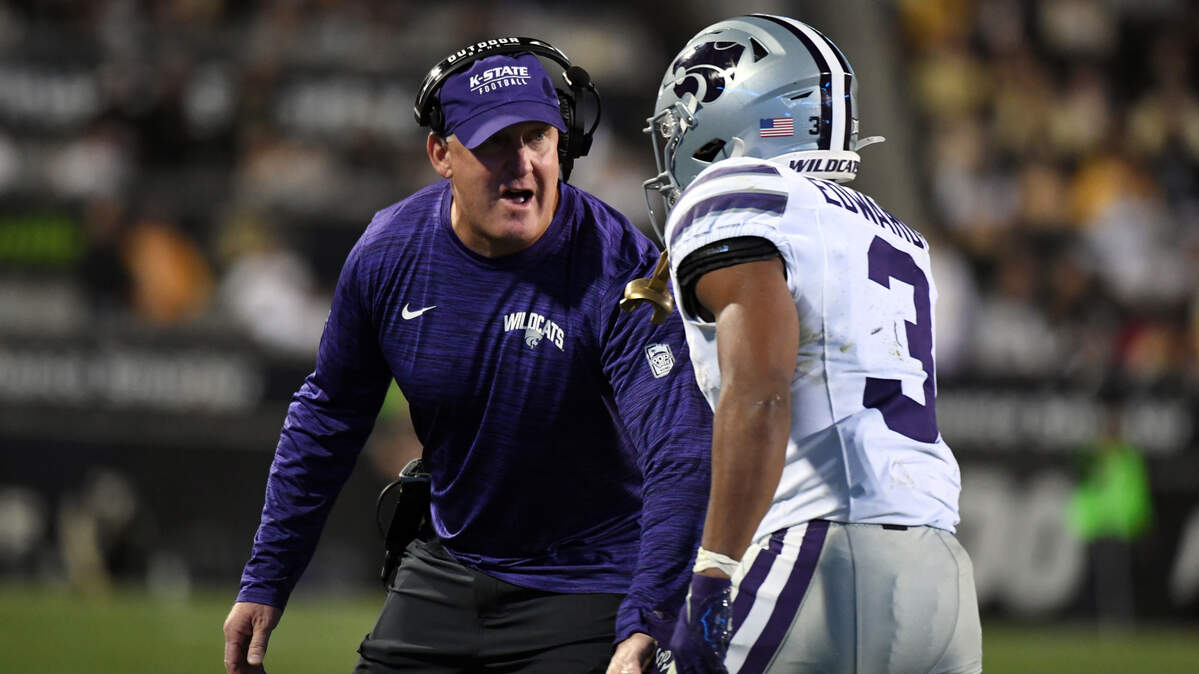 Kansas State Wildcats running back Dylan Edwards (3) celebrates with head coach Chris Klieman after a touchdown during the first half against the Colorado Buffaloes at Folsom Field. 