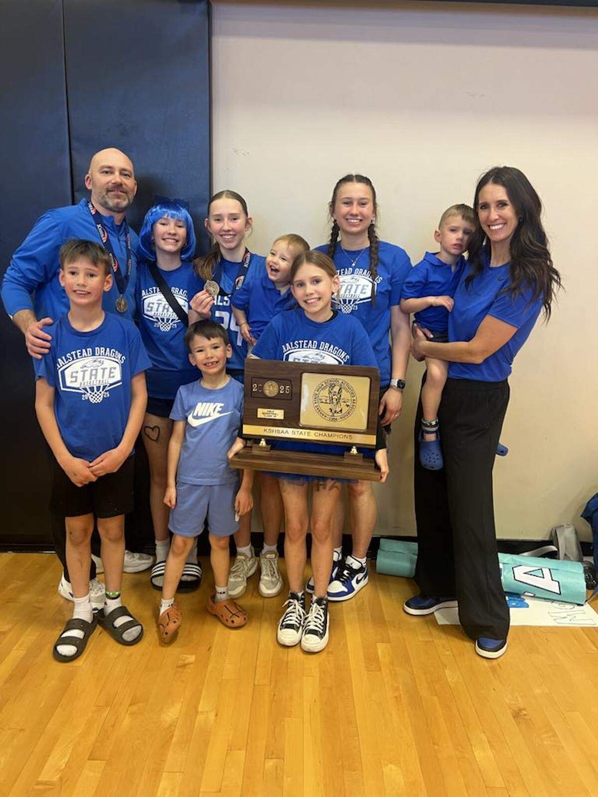 The Schutte family celebrates after winning one of two state championships this past school year.