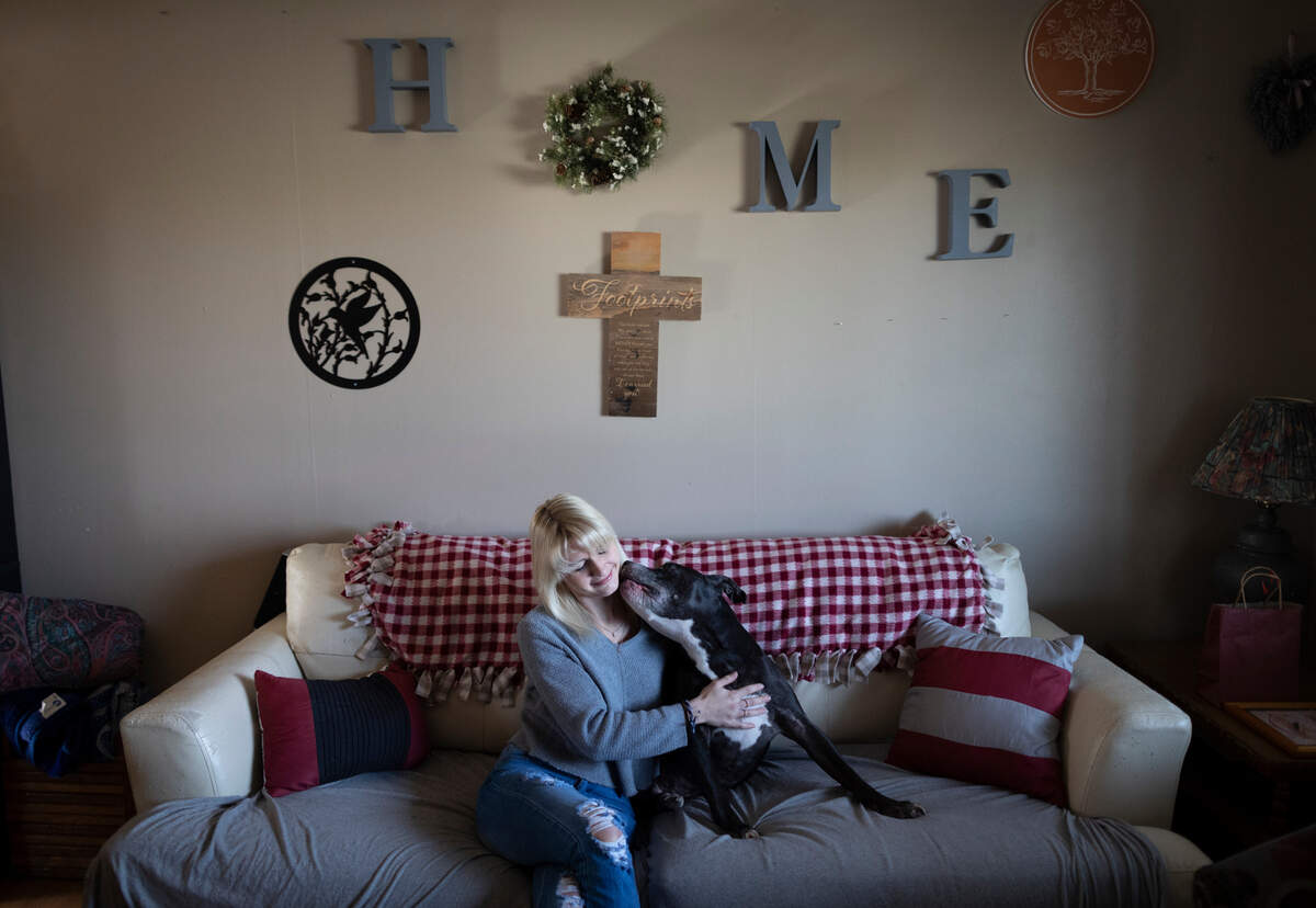 Brooklynn Nimmo gets kisses from her dog, Wilbur. The family pitbull used to snuggle up to Nimmo’s mother before she was killed by Nimmo’s father. Wilbur now helps motivate Nimmo to get out of bed.