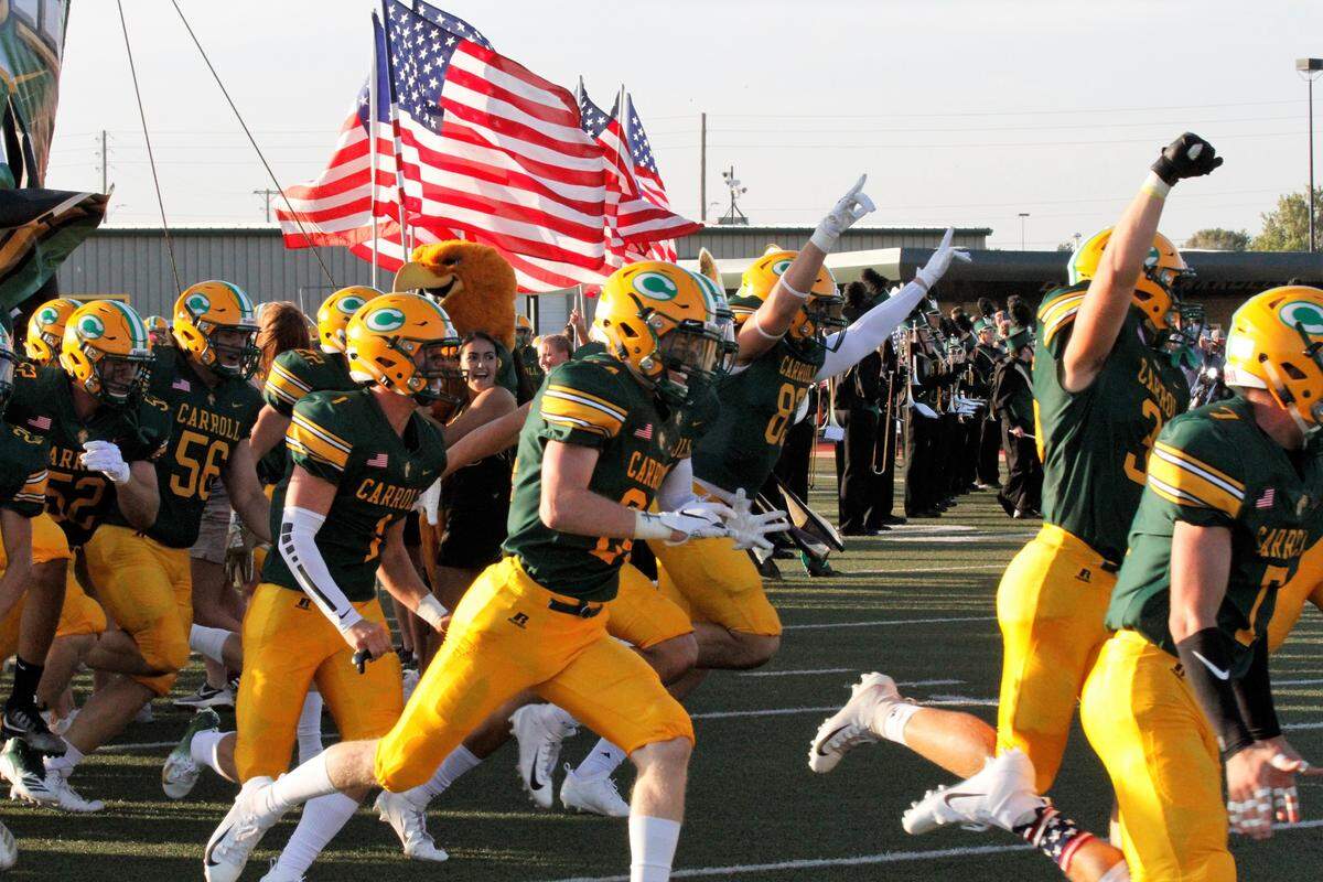 Bishop Carroll runs onto the field before the Golden Eagles’ 23-22 loss to Wichita Northwest on Friday night. (Aug. 31, 2018)