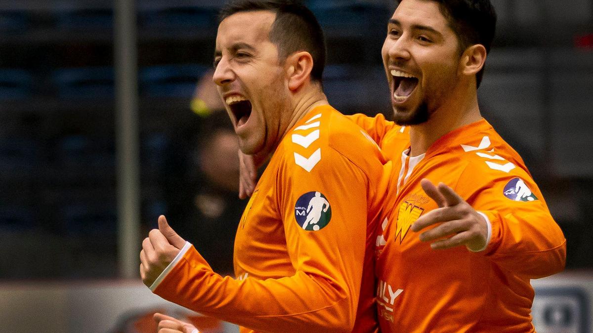 The Wings Jared Robbins, left, celebrates after scoring with teammate Leo Sosa, right, against New Mexico in the second period at Hartman Arena Sunday.
