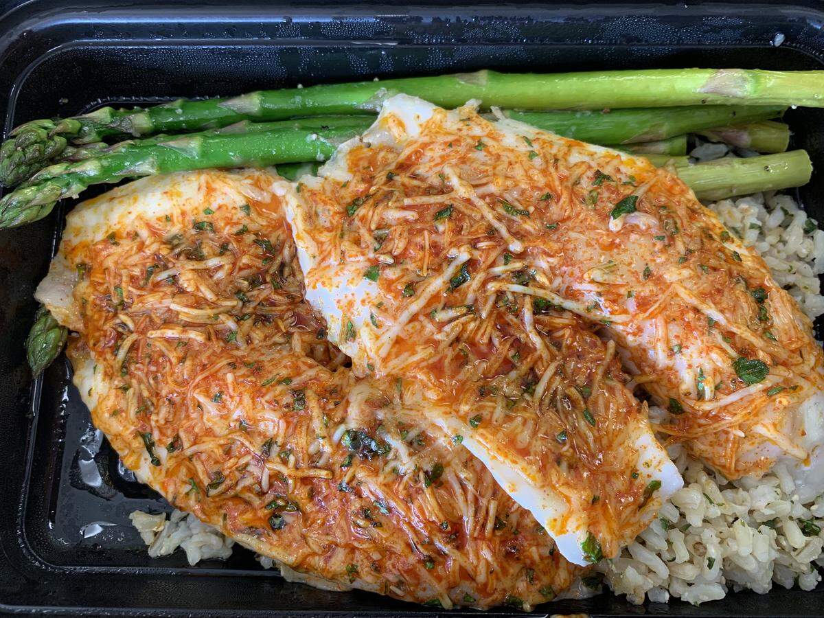 Parmesan-crusted tilapia with brown rice and asparagus is the type of healthy, gluten-free prepackaged meal that Kira Ottaway Watt serves at Perfect Plate.
