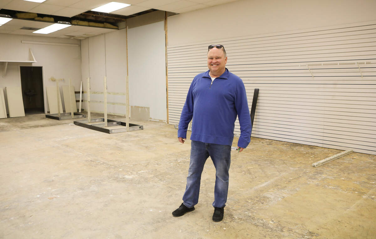 Dave Binter, owner of Central Market Wine and Spirits stands in an area he will convert into a bar. (April 2, 2019)