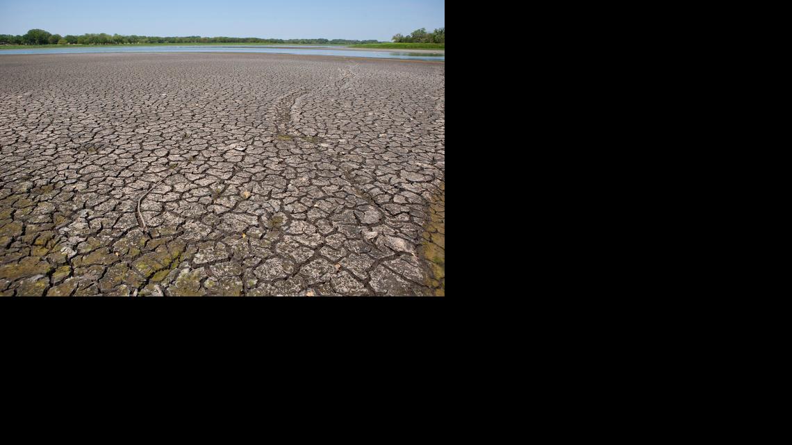 High temperatures and a lack of rain were evident at Santa Fe Lake in 2011. Weather experts are in disagreement about whether this summer will lock in drought conditions or whether the jet stream’s weakness will mean precipitation in the state. (July 22, 2011)

