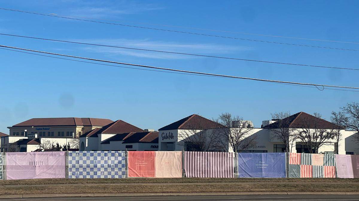 If you’re one of the passersby who have been wondering what’s going to go where the colorful fencing is at Bradley Fair at 21st and Rock Road, there’s now an answer.