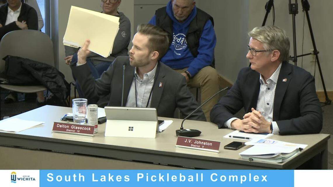 District 4 Wichita City Council member Dalton Glasscock holds up a stack of printed email he’s received from constituents about pickleball at a March 26, 2024 workshop.