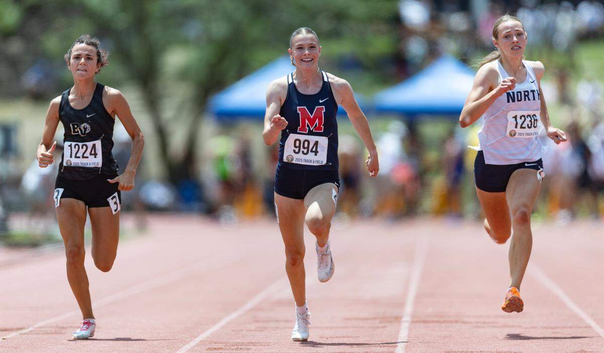 Harli Omli of Manhattan wins the 6A 100 meter dash on Saturday at Cessna Stadium.