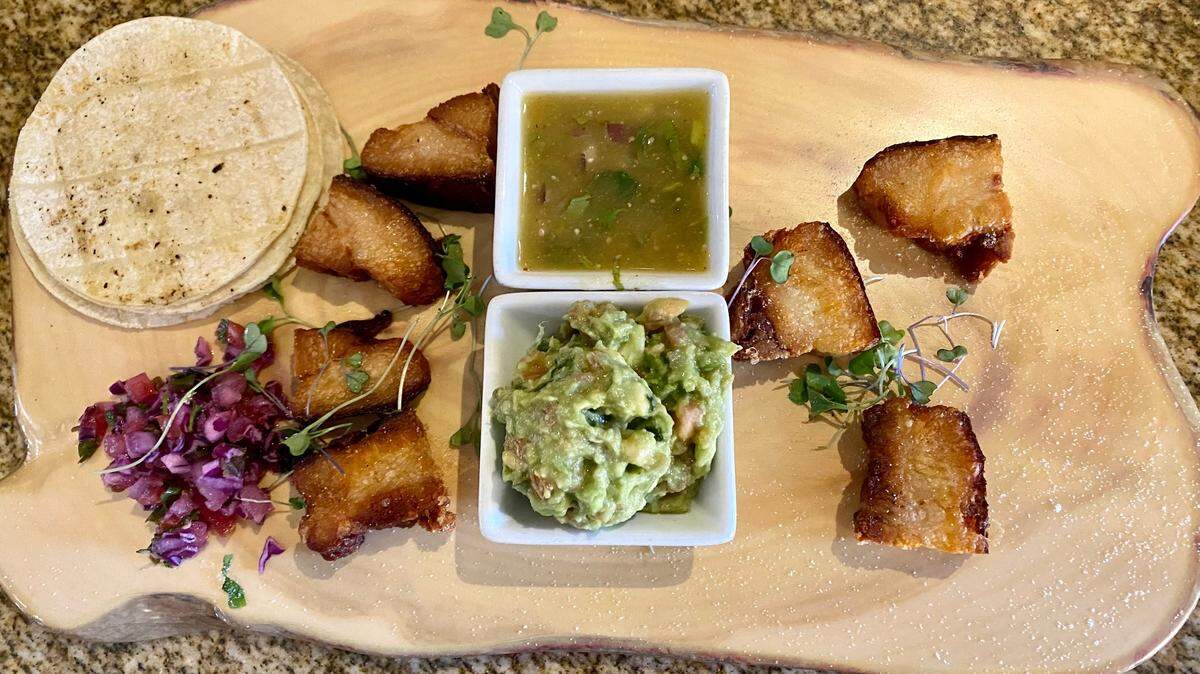 Pork belly bites served with green salsa, guacamole and tortillas is one of the new shareable items being offered at Molino’s.