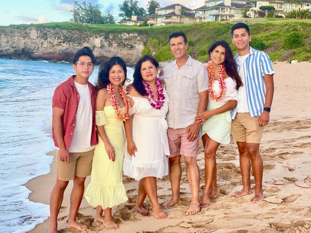 Manuel Esparza poses for a family photo during a recent vacation in Hawaii. From left: Mickey, Ixy, Xochitl, Manuel, Ariana Nayeli and Diego.