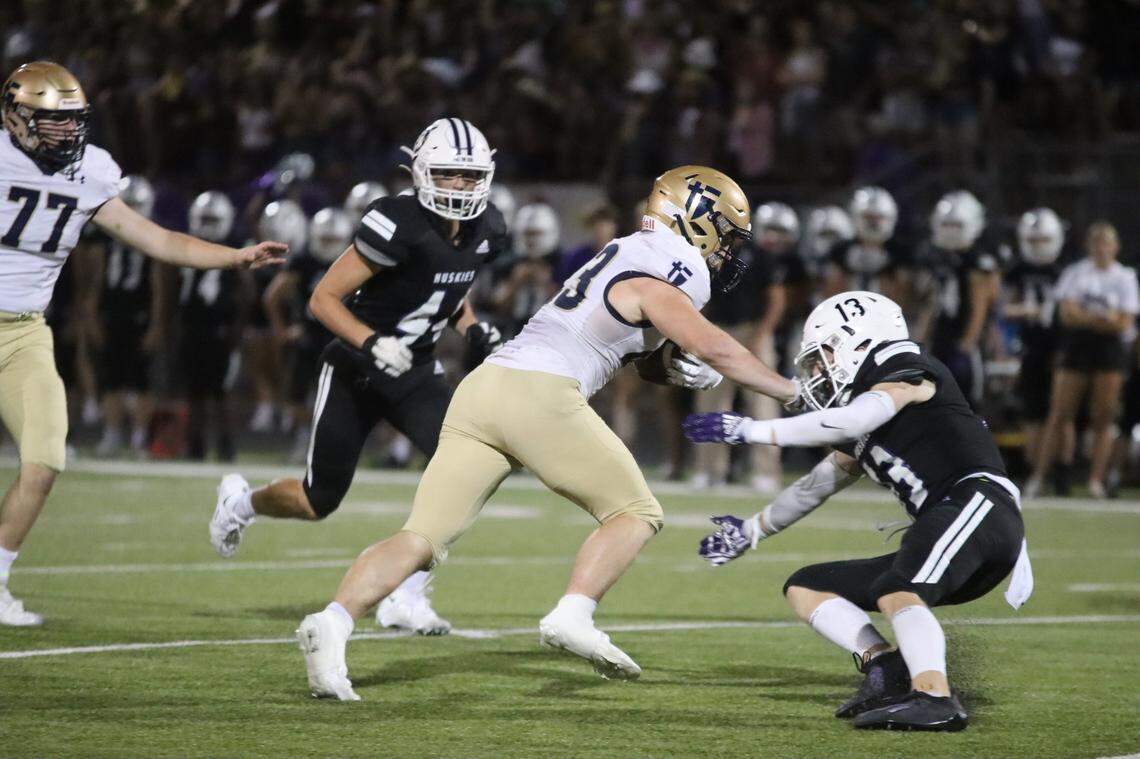 St. Thomas Aquinas running back Sean Carroll led the Saints to a win over Class 6A’s top-ranked team in Blue Valley Northwest last Friday.