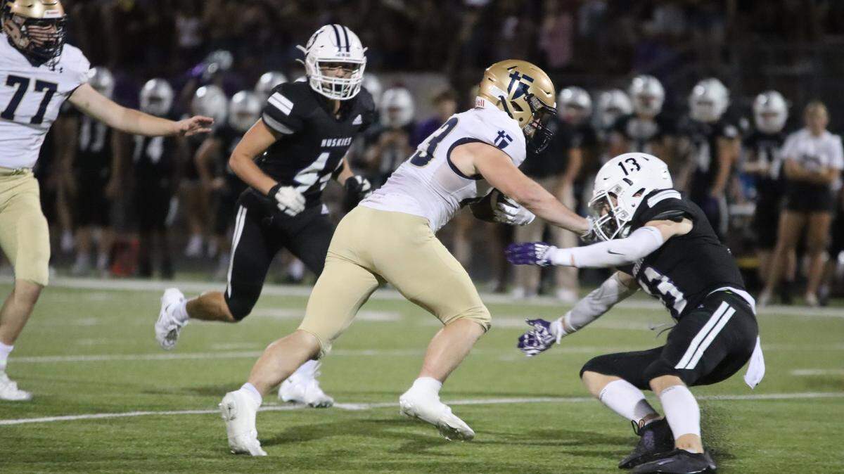St. Thomas Aquinas running back Sean Carroll led the Saints to a win over Class 6A’s top-ranked team in Blue Valley Northwest last Friday.