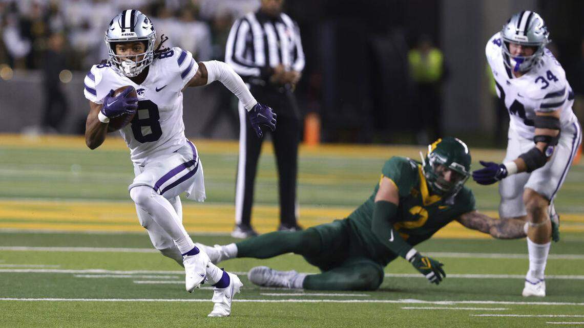 Kansas State wide receiver Phillip Brooks runs downfield past Baylor linebacker Matt Jones and tight end Ben Sinnott, right, in the first half of an NCAA college football game, Saturday, Nov.12, 2022, in Waco, Texas. (Rod Aydelotte/Waco Tribune-Herald via AP)