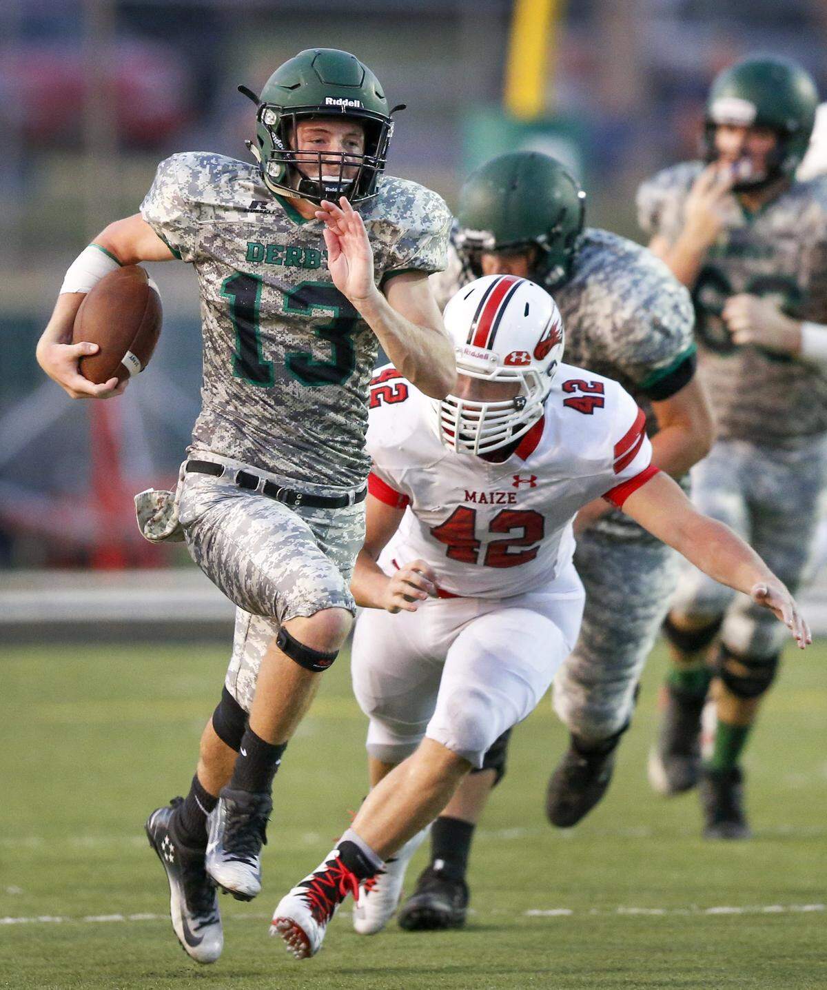 Derby QB Grant Adler (13) heads downfield for a large gain against Maize during the second quarter at Derby High Friday. (Sept. 15, 2017)