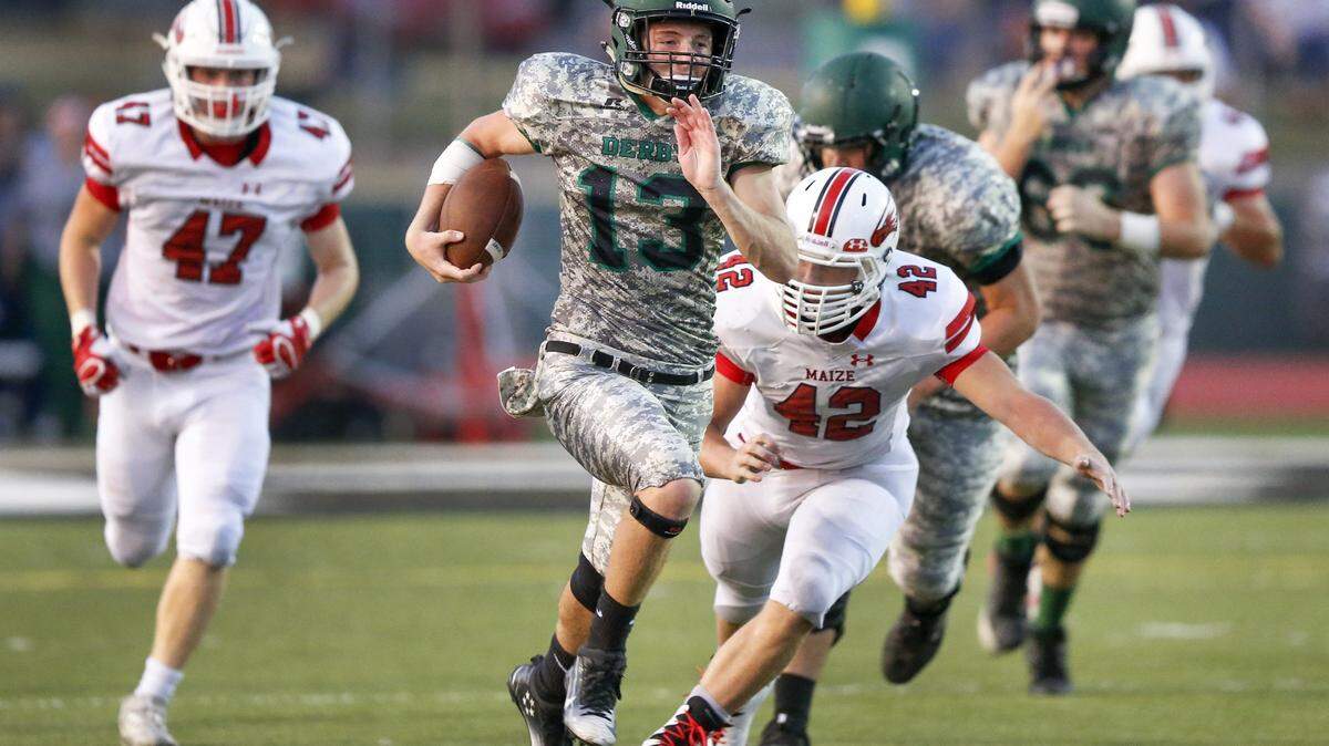 Derby QB Grant Adler (13) heads downfield for a large gain against Maize during the second quarter at Derby High Friday. (Sept. 15, 2017)