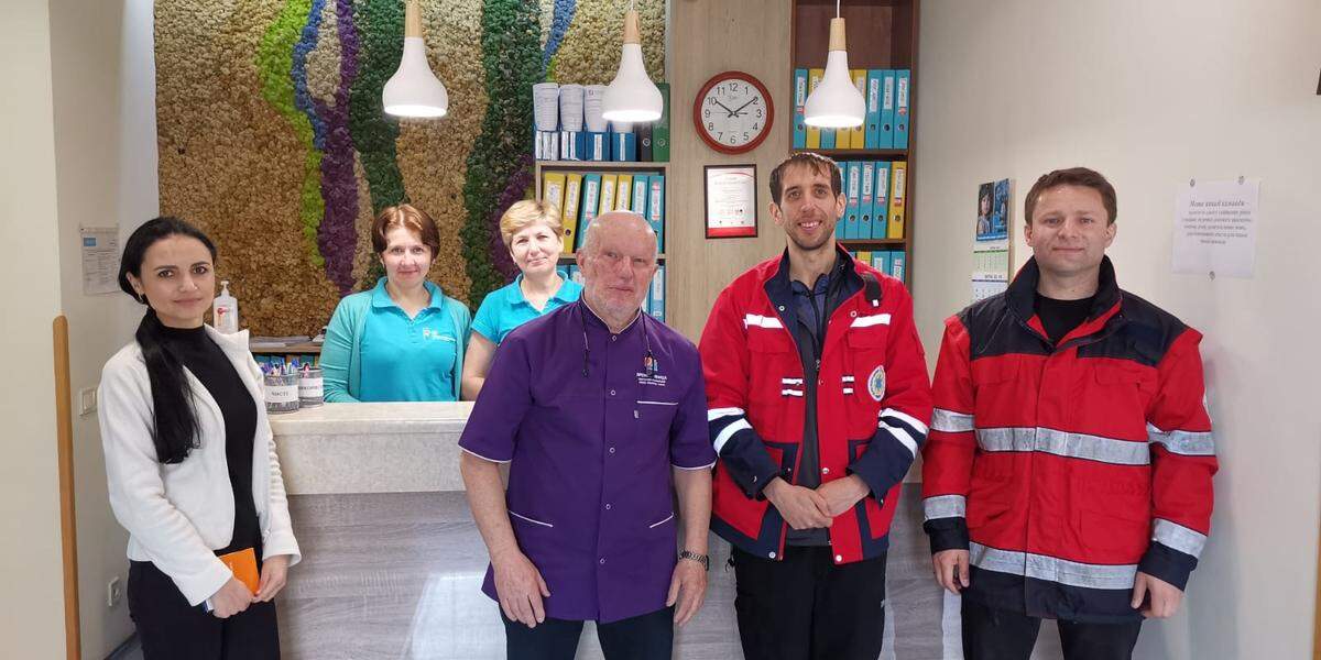 Dr. Josh Davis, second from right, an emergency room physician at Ascension Via Christi St. Francis Hospital, recently spend a week in western Ukraine offer medical care for patients in need.