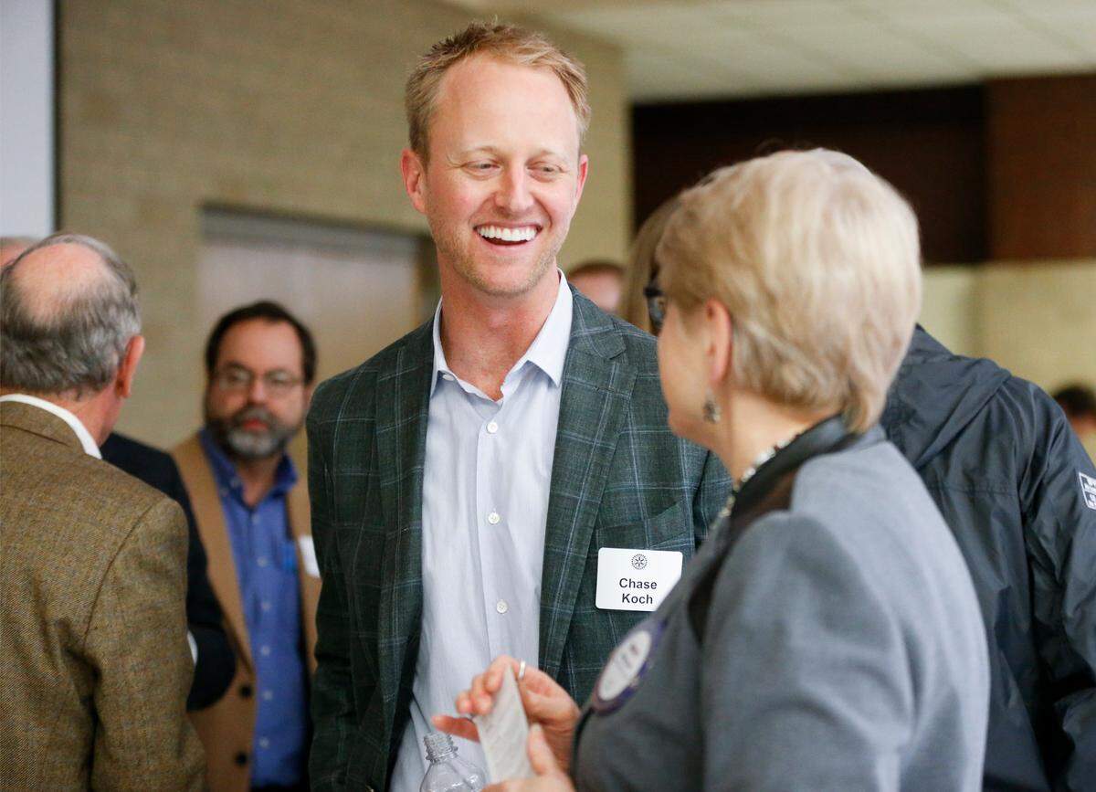 Chase Koch spoke with attendees following his 2016 speech at the downtown Wichita Rotary club.