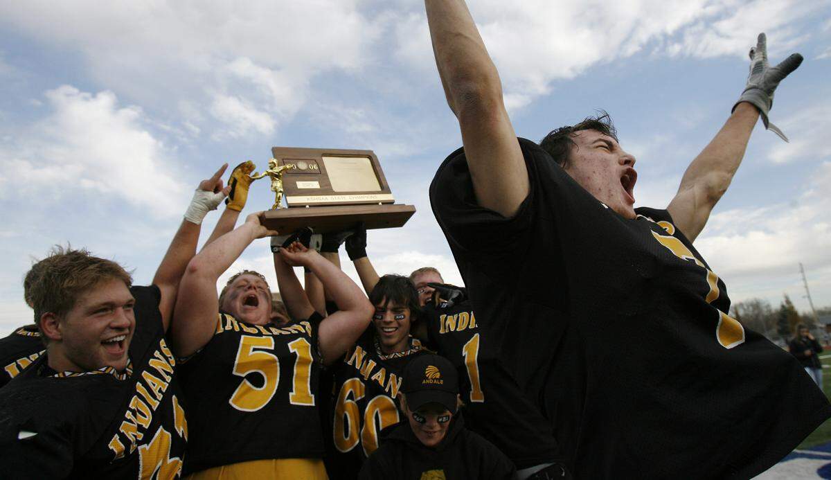 Andale High School football players celebrate winning the 4A Kansas High School Football Championship on Saturday, Nov. 25, 2006 in Hutchinson, Ks. Andale defeated Paola 35-7 to win their first ever state title and Robben finished the 200 yards rushing and three touchdowns. PHOTO BY TRAVIS HEYING, The Wichita Eagle