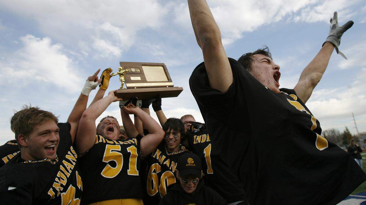 Andale High School football players celebrate winning the 4A Kansas High School Football Championship on Saturday, Nov. 25, 2006 in Hutchinson, Ks. Andale defeated Paola 35-7 to win their first ever state title and Robben finished the 200 yards rushing and three touchdowns. PHOTO BY TRAVIS HEYING, The Wichita Eagle