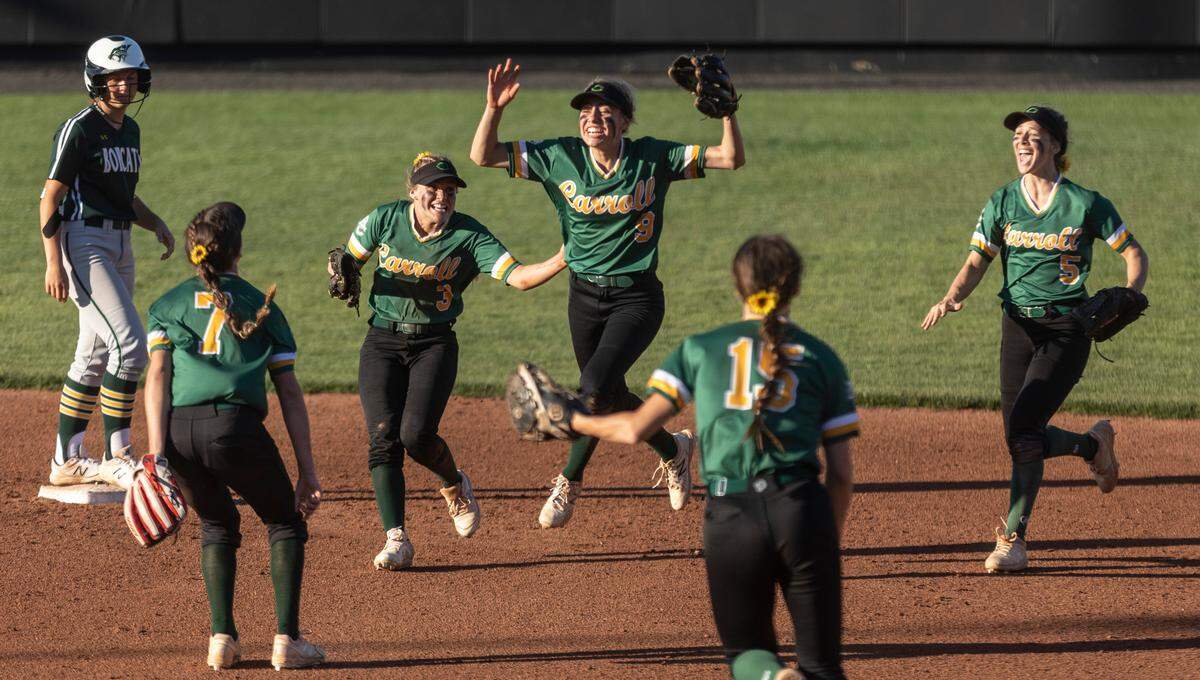 The Bishop Carroll softball team celebrates winning the 2021 Class 5A state championship at Wichita State’s Wilkins Stadium.