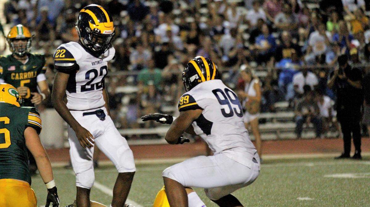 Marcus Hicks (99), a Wichita Northwest senior defensive end, celebrates a tackle for loss in the Grizzlies’ 23-22 win at Bishop Carroll on Friday night. (Aug. 31, 2018)