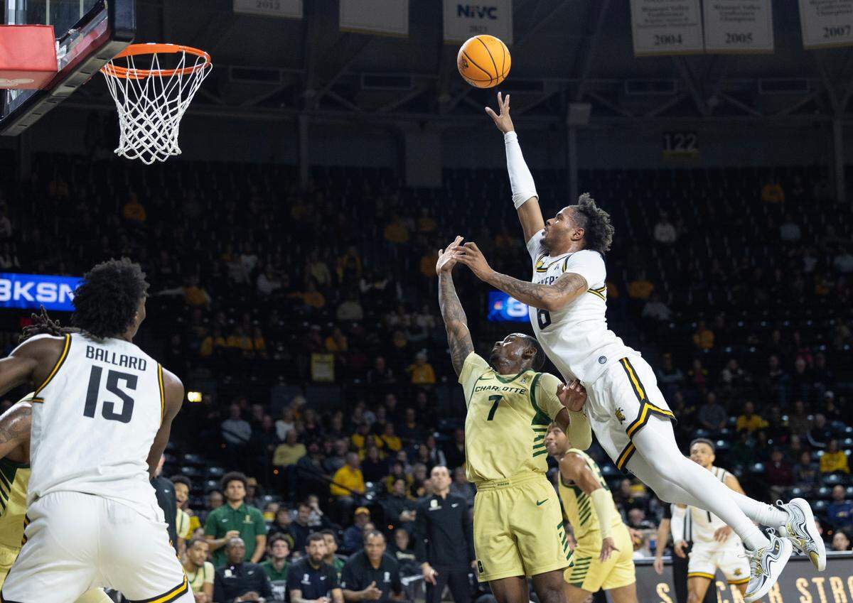Wichita State’s Corey Washington leans into a shot during the first half of their game against Charlotte on Tuesday night at Koch Arena.