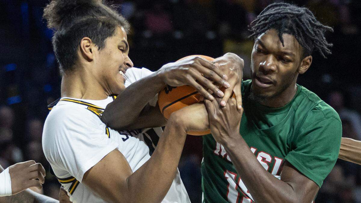 Wichita State’s Kenny Pohto fights for a rebound with Mississippi Valley’s Alvin Stredic during the first half of their game on Tuesday night at Koch Arena.
