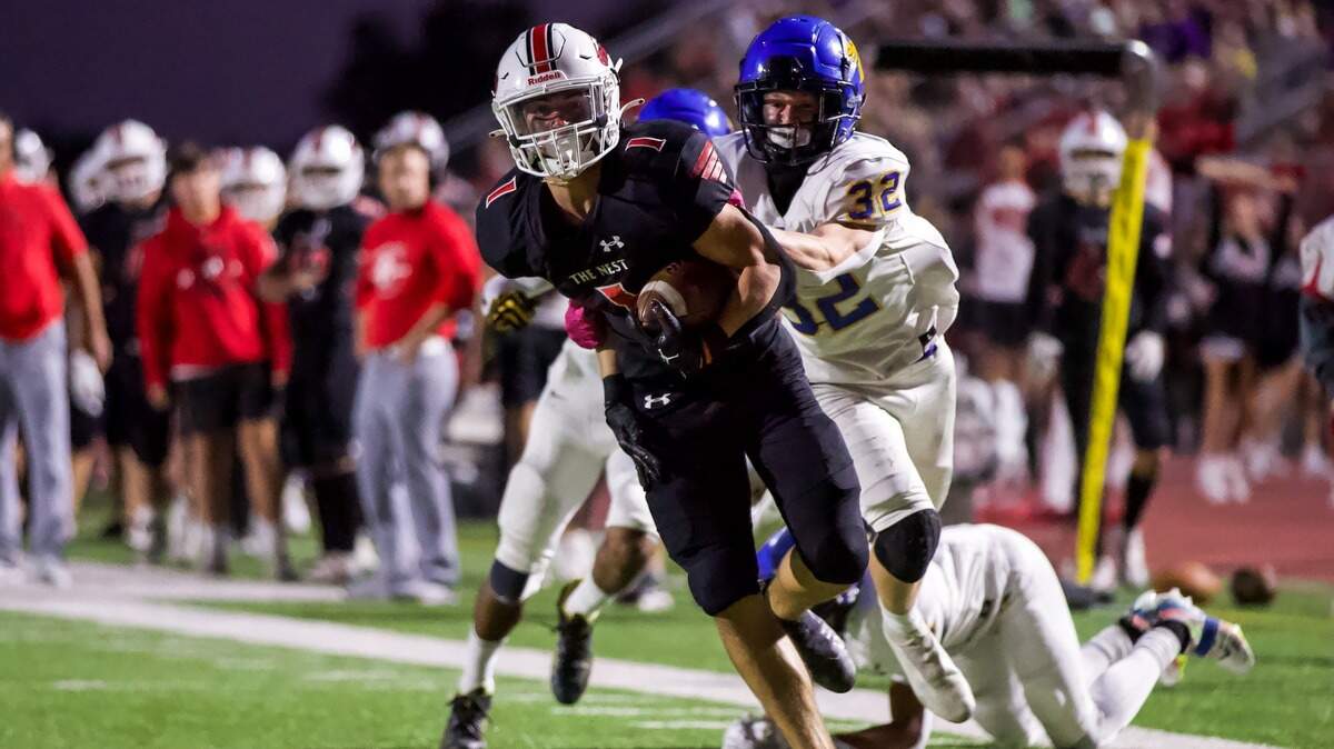 Bryson Hayes looks to score for the Maize football team earlier this season. The Eagles advanced to their second straight Class 5A state championship game with Friday’s win.