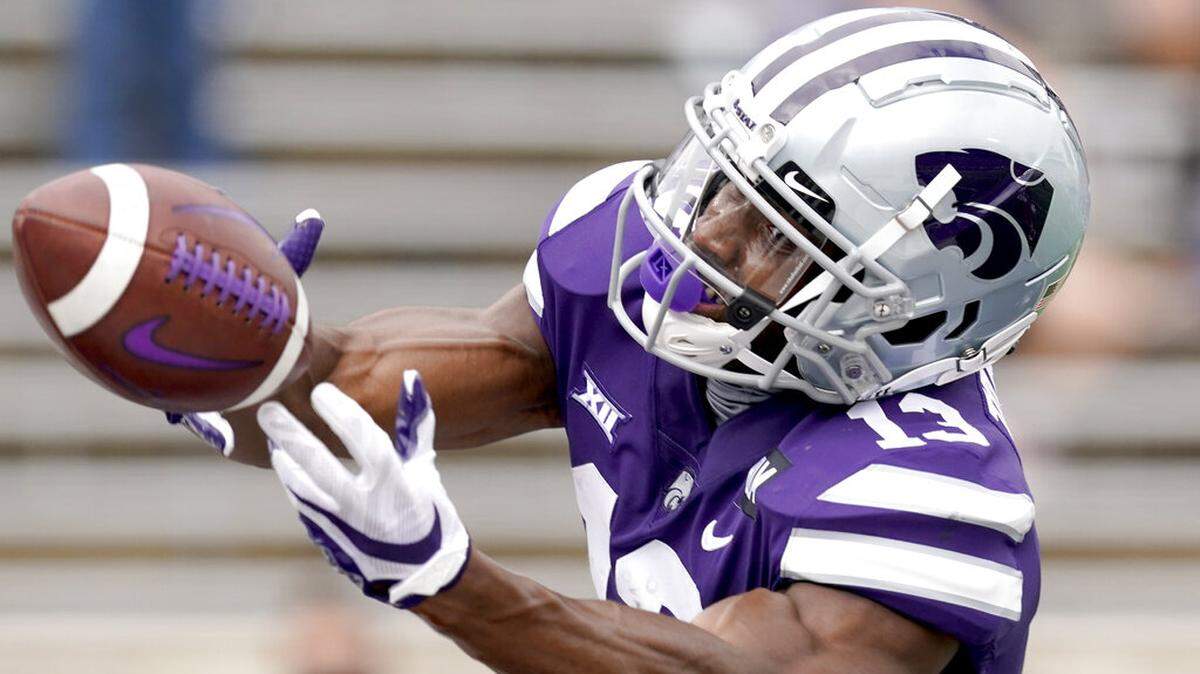 Kansas State wide receiver Chabastin Taylor (13) reaches for a pass during the first half of an NCAA college football game against Arkansas State Saturday, Sept. 12, 2020, in Manhattan, Kan. (AP Photo/Charlie Riedel)