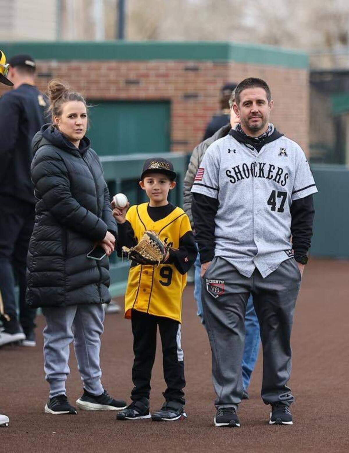 One of the highlights for Michael Church (right) and his wife, Laura (left) the past few months was the Wichita State baseball game where their 8-year-old son Kendric was able to throw out the first pitch.