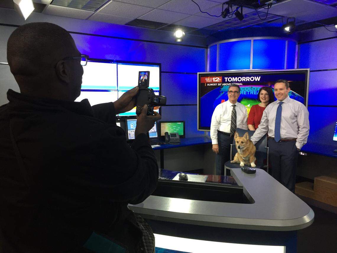 Millie the Weather Dog poses with the rest of the KWCH 12 Storm Team.