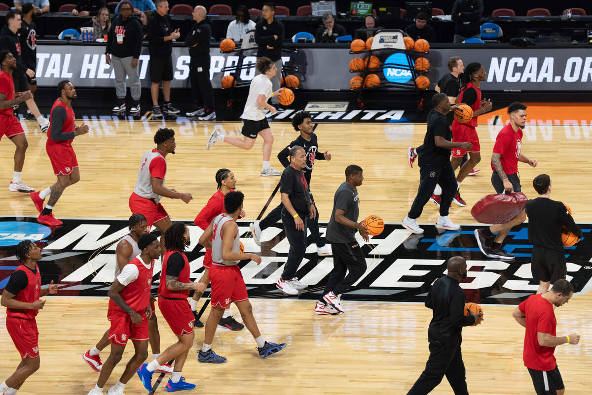 University of Houston men’s basketball takes the court for an open practice at the 2025 NCAA Division I Men’s Basketball Championship at INTRUST Bank Arena. At center is head coach Kelvin Sampson.