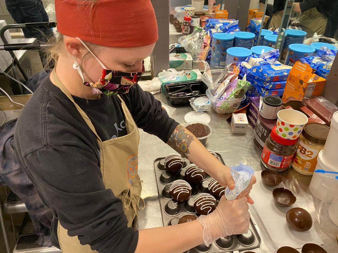 Lexi Mastrobuono decorates hot cocoa bombs at Papa’s General Store, 3700 E. Douglas.