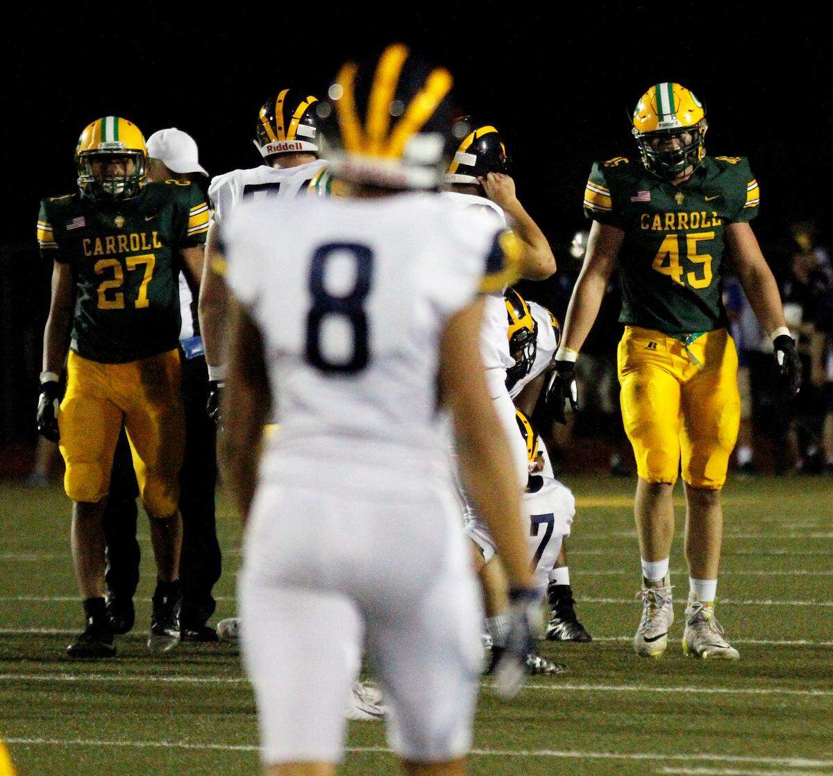 Carroll’s Phoenix Smith (27) and Keaton Ricke (45) provided the Golden Eagles’ with a great pass rush and run defense in Week 1.