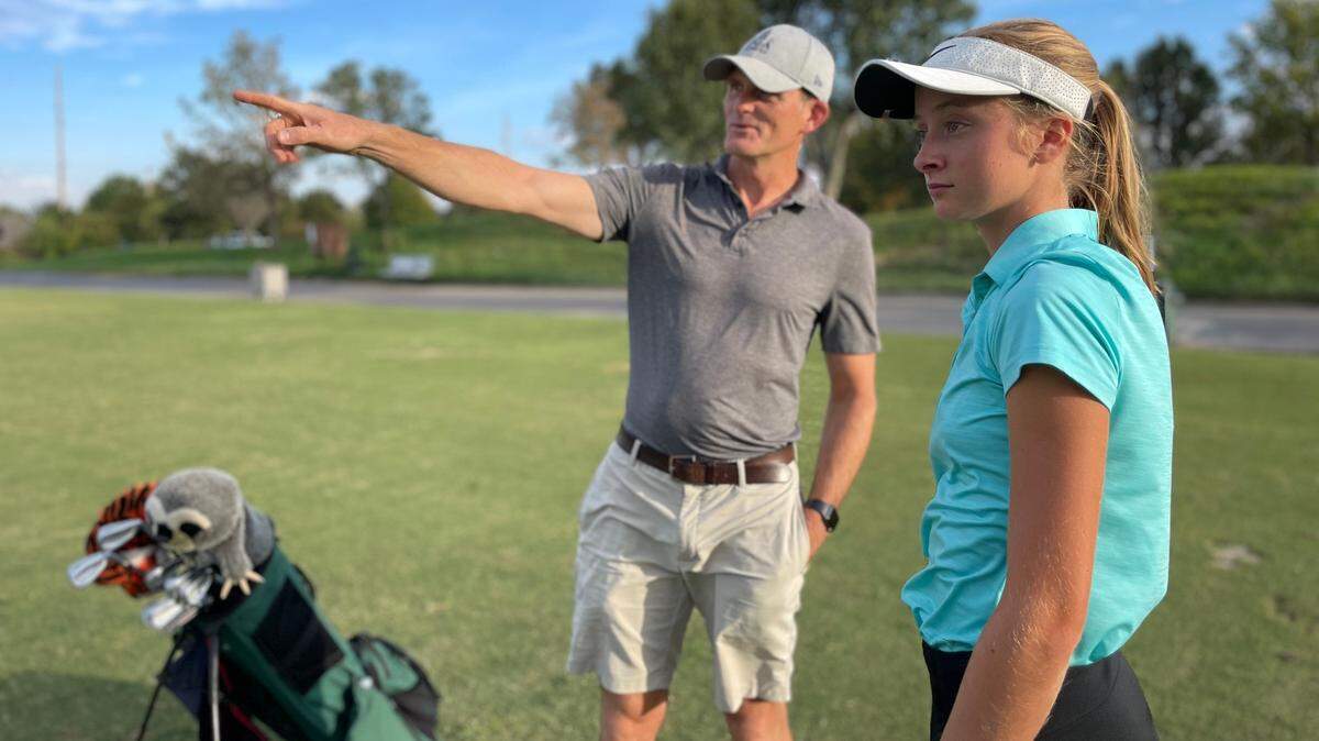 Bishop Carroll senior Keira Ronsick, right, has carved out a superb high school golf career with the help of her father, Mike, a former punter on the K-State football team.