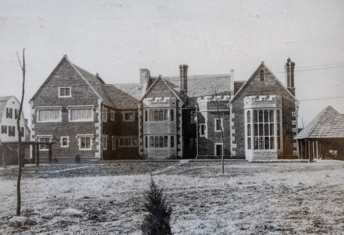 An early photo of the back of The Clapp Manor at 320 N. Belmont
