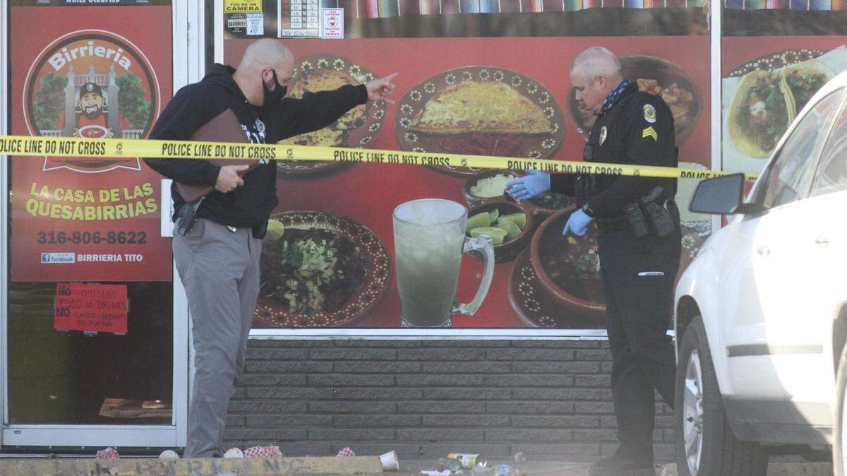 Wichita police look around outside of Birrieria Tito restaurant, which is near Hydraulic and Wassall, after a man was fatally shot Thursday. A suspect was arrested near the south Wichita restaurant.