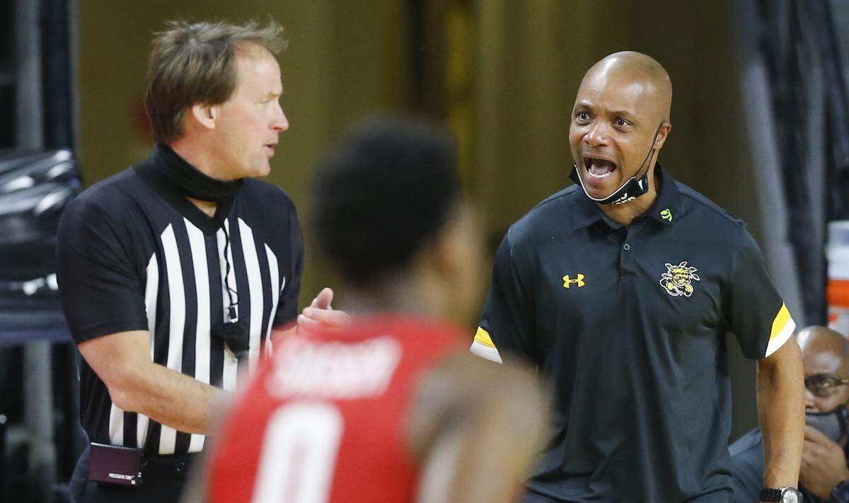 Wichita State interim head coach Isaac Brown expresses his displeasure with referee John Higgins during the first half of their game against Houston on Thursday.