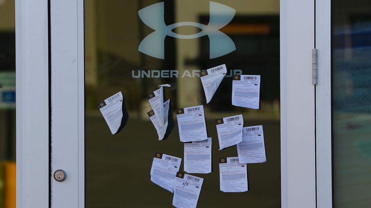 Under Armour is delayed in getting its new Wichita store open at Greenwich Place due to supply-chain issues. Ironically, the door to the new store is papered with notices about missed deliveries.