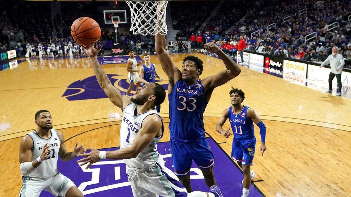 Kansas State guard Markquis Nowell (1) puts up a shot during the second half of an NCAA college basketball game against Kansas Saturday, Jan. 22, 2022, in Manhattan, Kan. Kansas won 78-75. (AP Photo/Charlie Riedel)