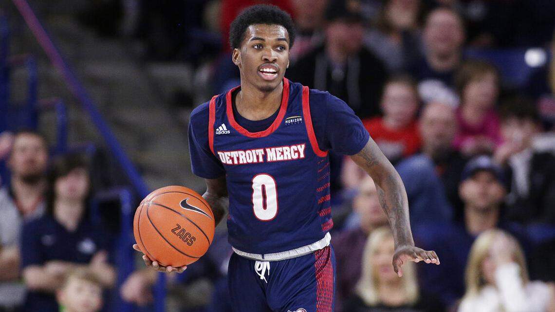 FILE - Detroit Mercy guard Antoine Davis brings the ball up during the second half of the team’s NCAA college basketball game against Gonzaga in Spokane, Wash., Dec. 30, 2019. Davis is entering the transfer portal, making the nation’s third-leading scorer available to another school for his fifth season. Davis announced his plans Thursday, April 14, on his social media accounts. (AP Photo/Young Kwak, File)