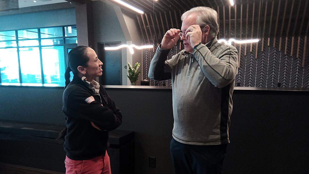 Rep. Sharice Davids talks with Wichita State University Vice President Andy Schlapp before touring WSU’s Innovation Campus, one of her stops on a 900-mile, four-city tour of Kansas.