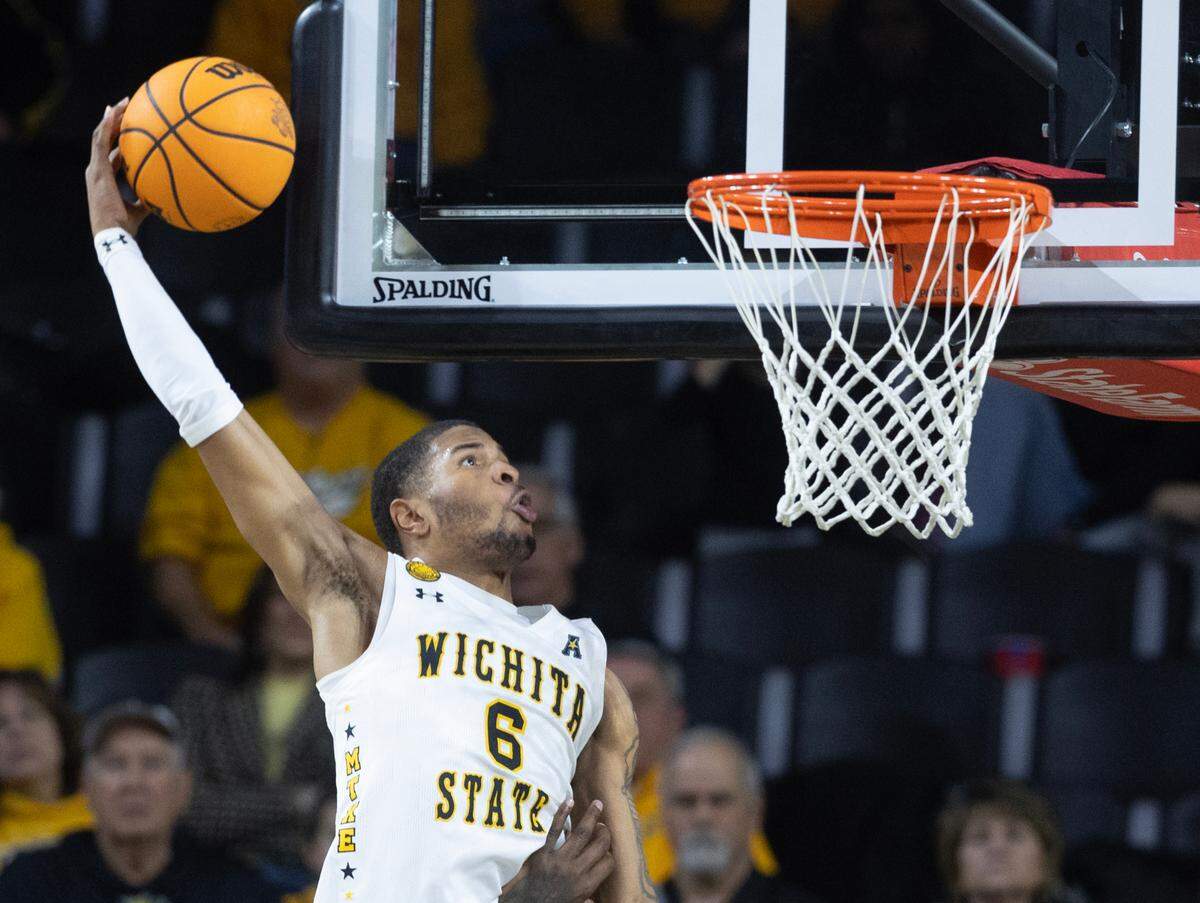 Corey Washington throws down a dunk against Memphis on Sunday at Koch Arena. 