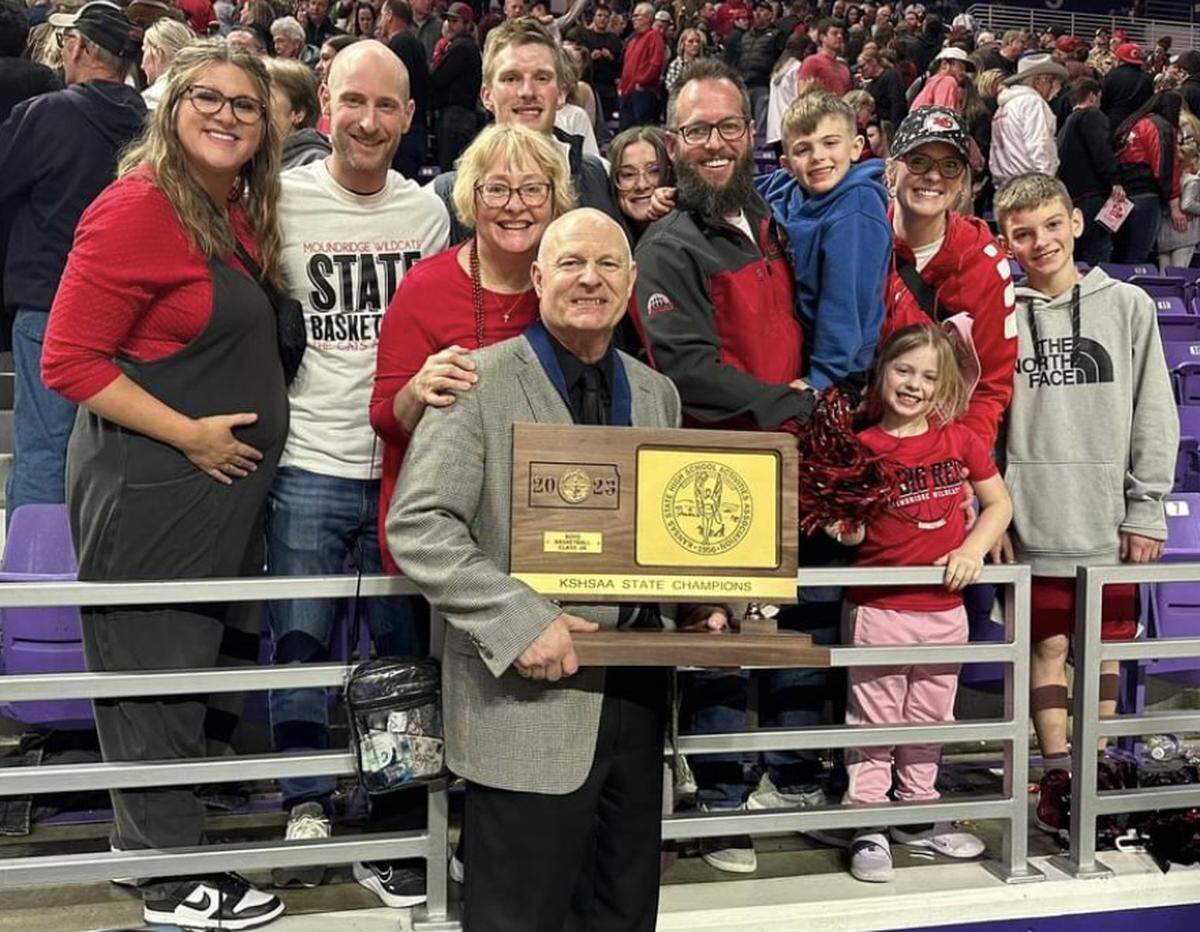 Moundridge boys basketball coach Vance Unrau celebrates his sixth and final state championship with his family. He is retiring after 36 years at the school.