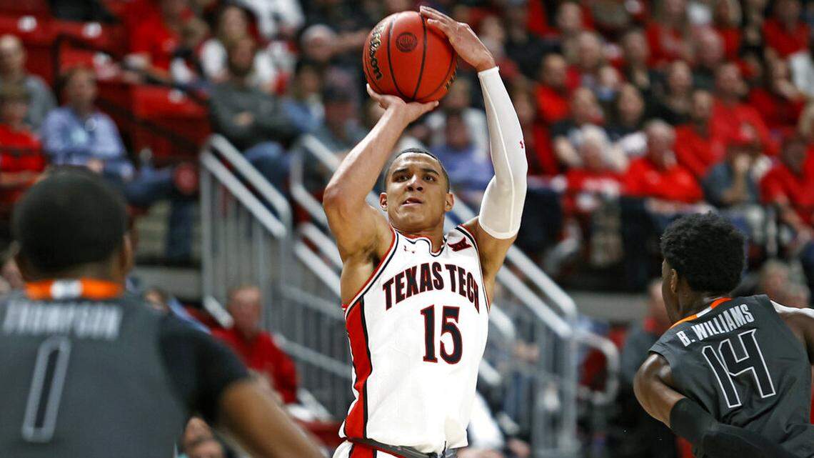 Texas Tech’s Kevin McCullar (15) shoots the ball during the first half of an NCAA college basketball game against Oklahoma State, Thursday, Jan. 13, 2022, in Lubbock, Texas. (AP Photo/Brad Tollefson)