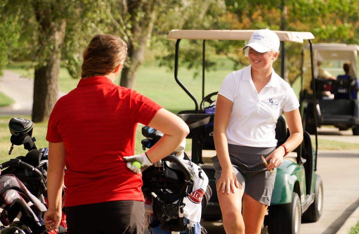 Kapaun senior Emma Whitaker talks to other golfers during the Class 5A girls golf state tournament. (October 17, 2016)